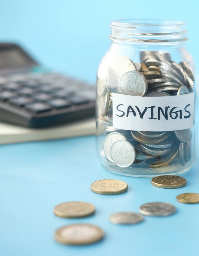 Jar of coins with a label that says "Savings"