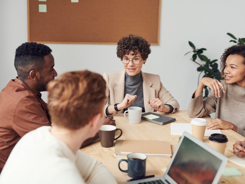 Partnership team collaborating around conference table