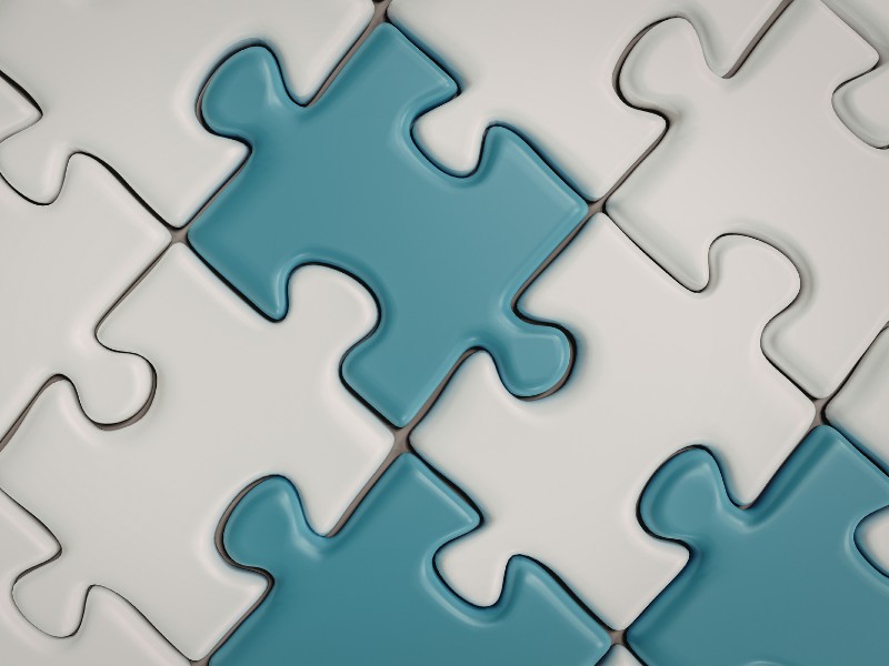 Teal and white puzzle pieces