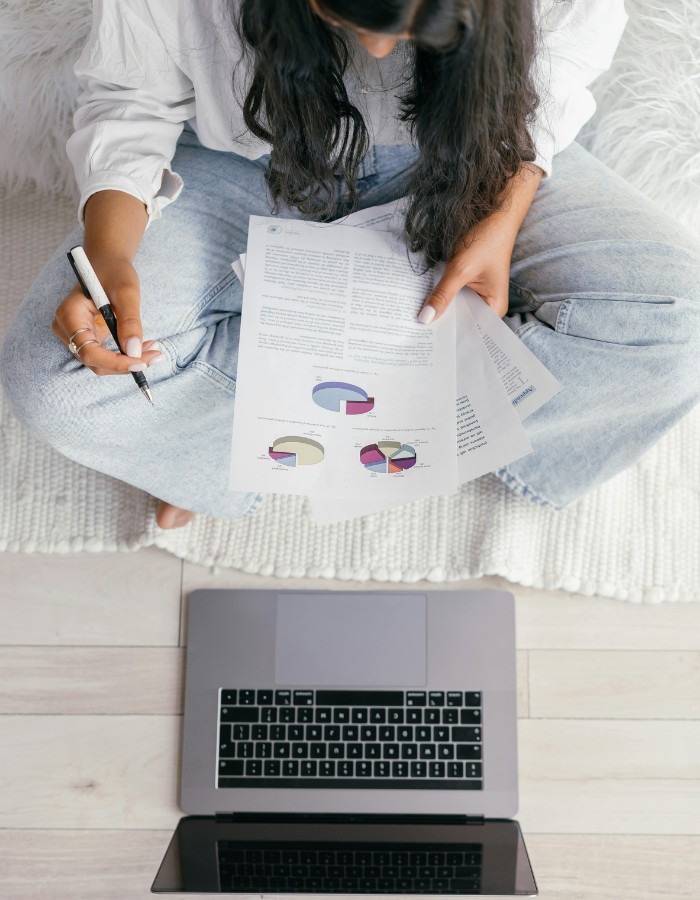 Woman studying statistics while sitting on floor