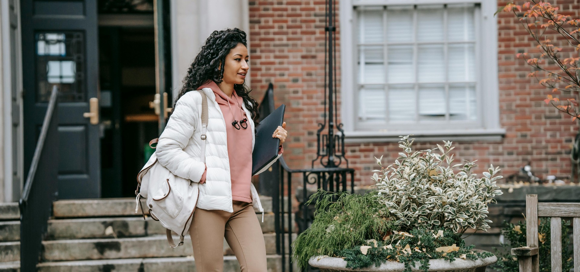 Young woman walking on college campus